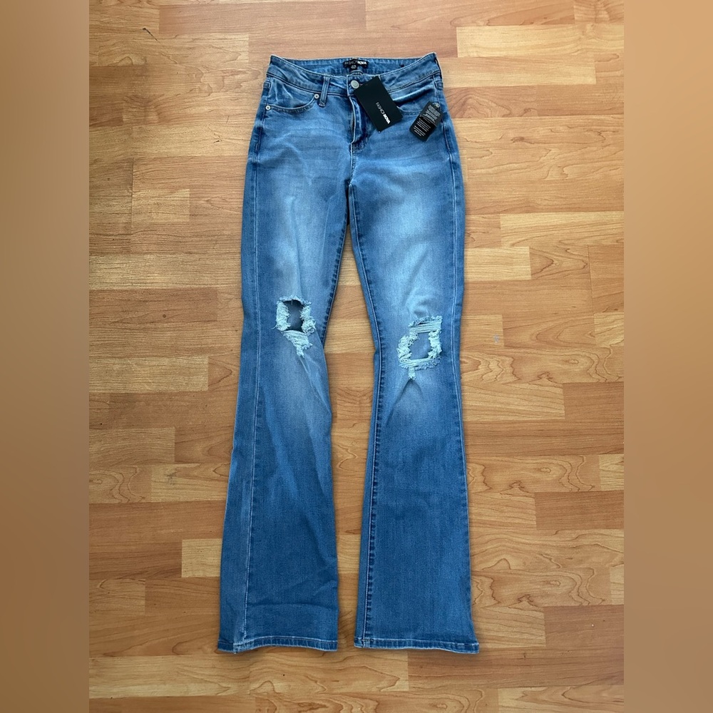 Denim distressed boot cut jeans